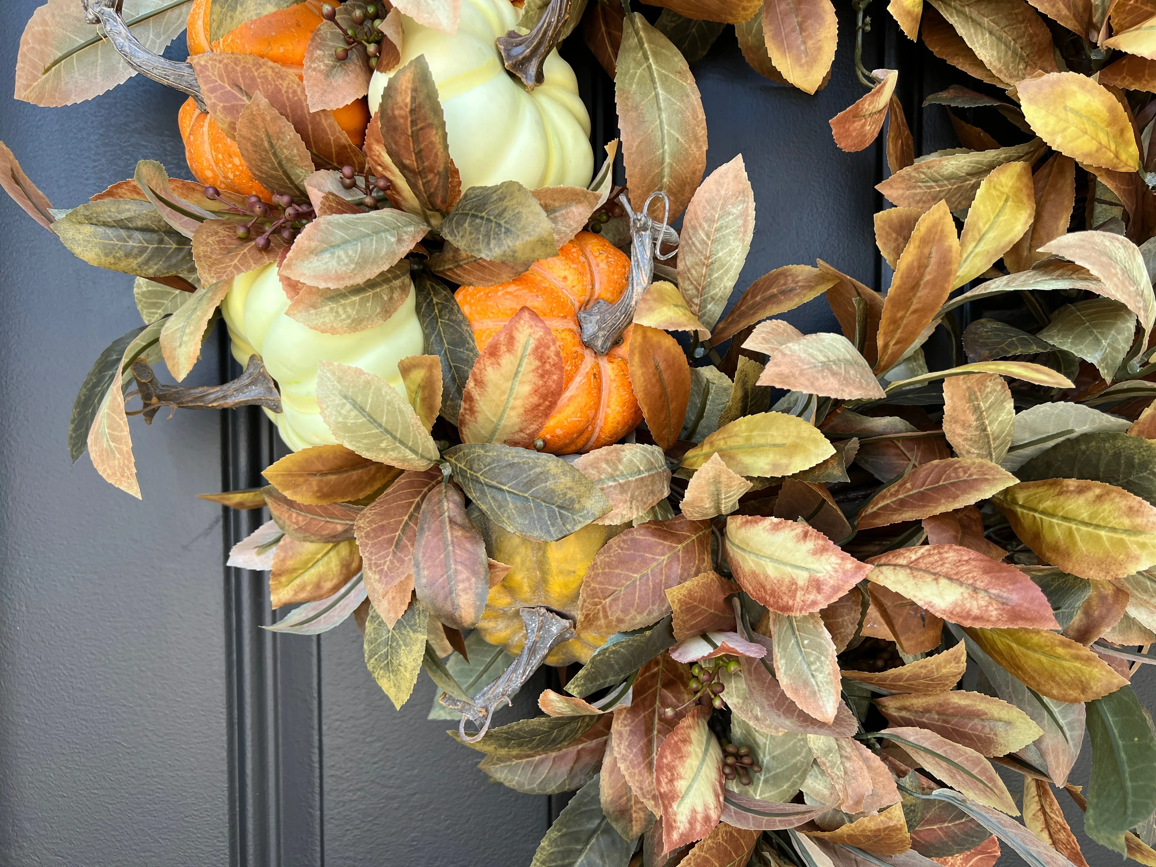 Seasonal Cascading Wreath with Orange, Cream, and Green Pumpkins