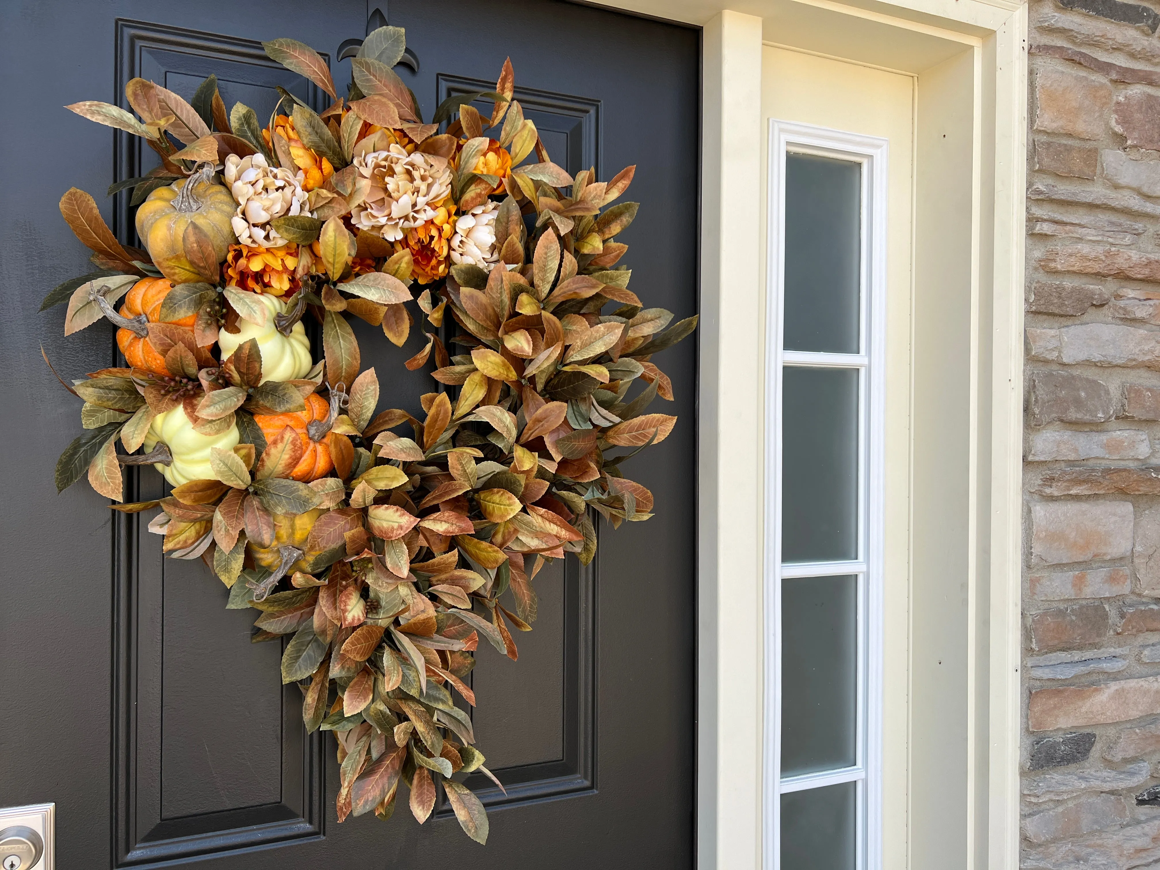 Seasonal Cascading Wreath with Orange, Cream, and Green Pumpkins