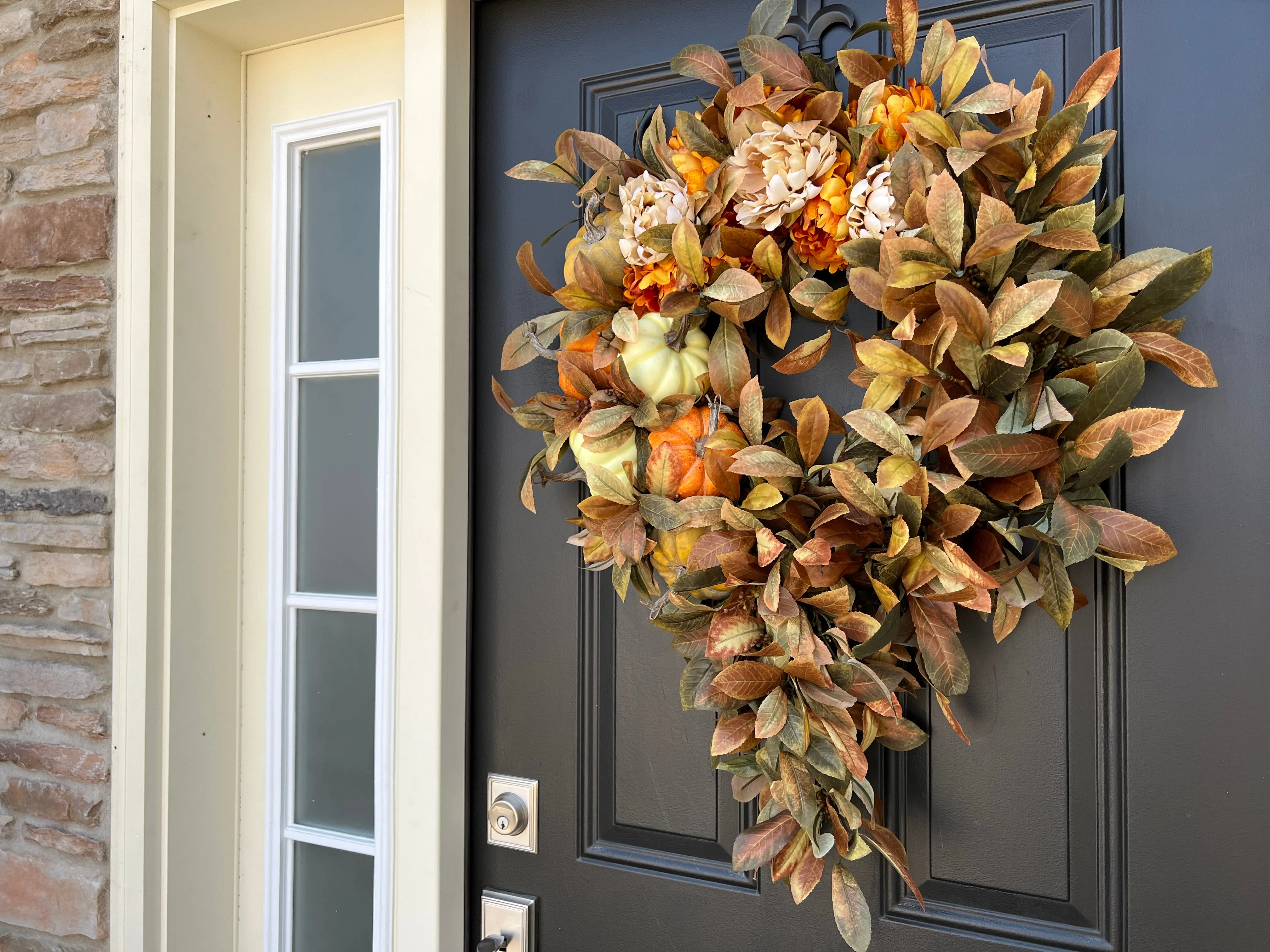 Seasonal Cascading Wreath with Orange, Cream, and Green Pumpkins