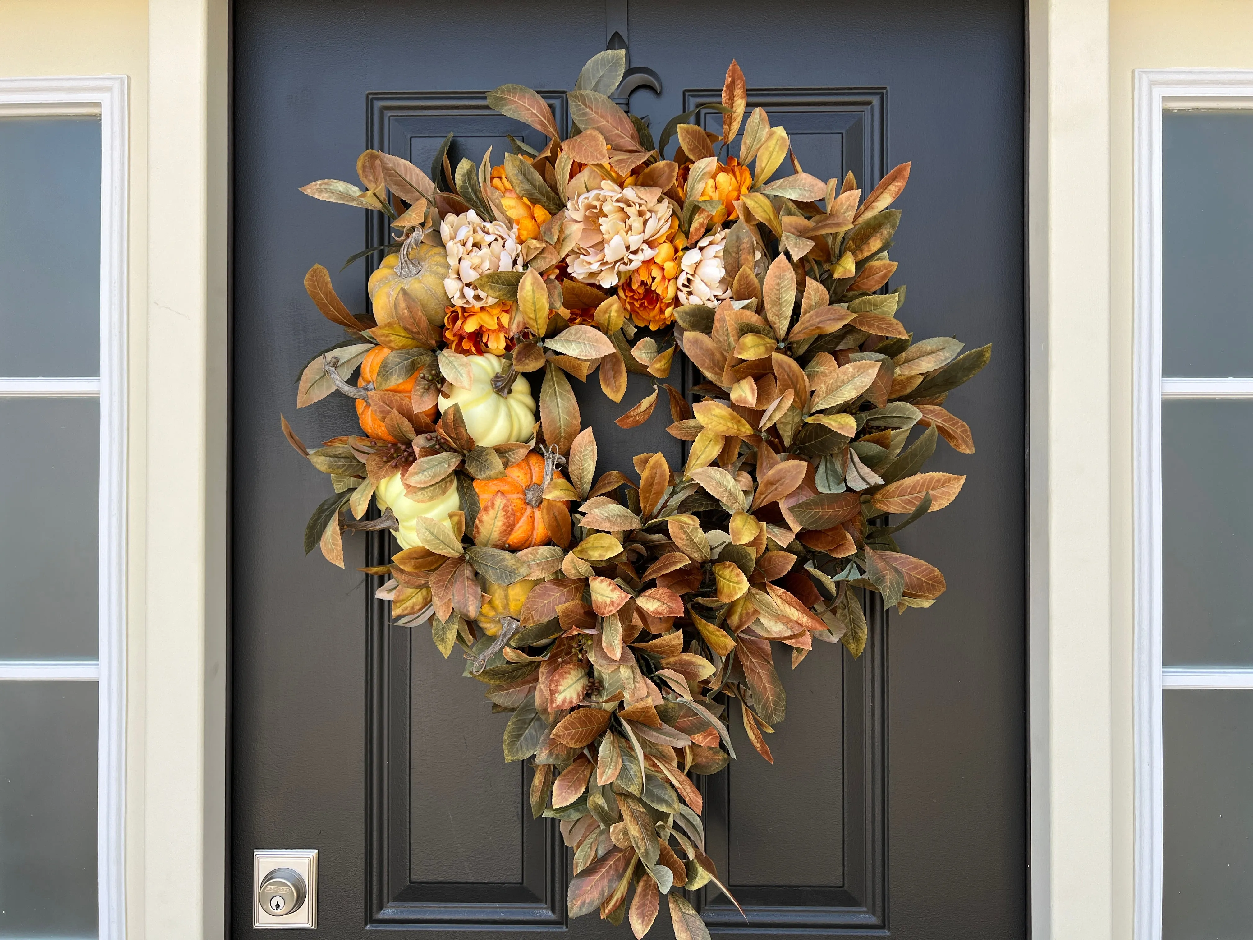 Seasonal Cascading Wreath with Orange, Cream, and Green Pumpkins